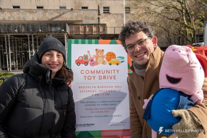 Spread Love Brooklyn founder Christina D'Asaro with City Councilmember Lincoln Restler and Peppa Pig at the Dec 2022 toy drive. 