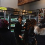 A Juice Press employee squeezes through crowds at the Brooklyn Heights Montague St. location.