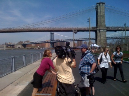 WPIX-TV's Monica Morales interviews a passerby at Brooklyn Bridge Park